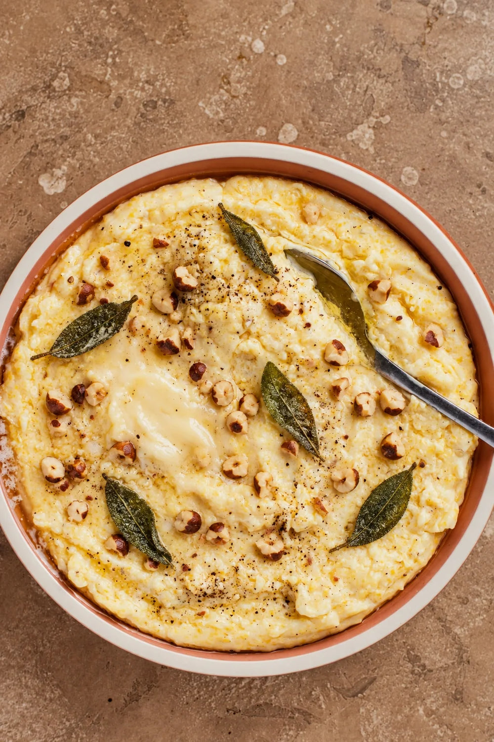 Polenta al tartufo con Fontina, nocciole tostate e salvia croccante
