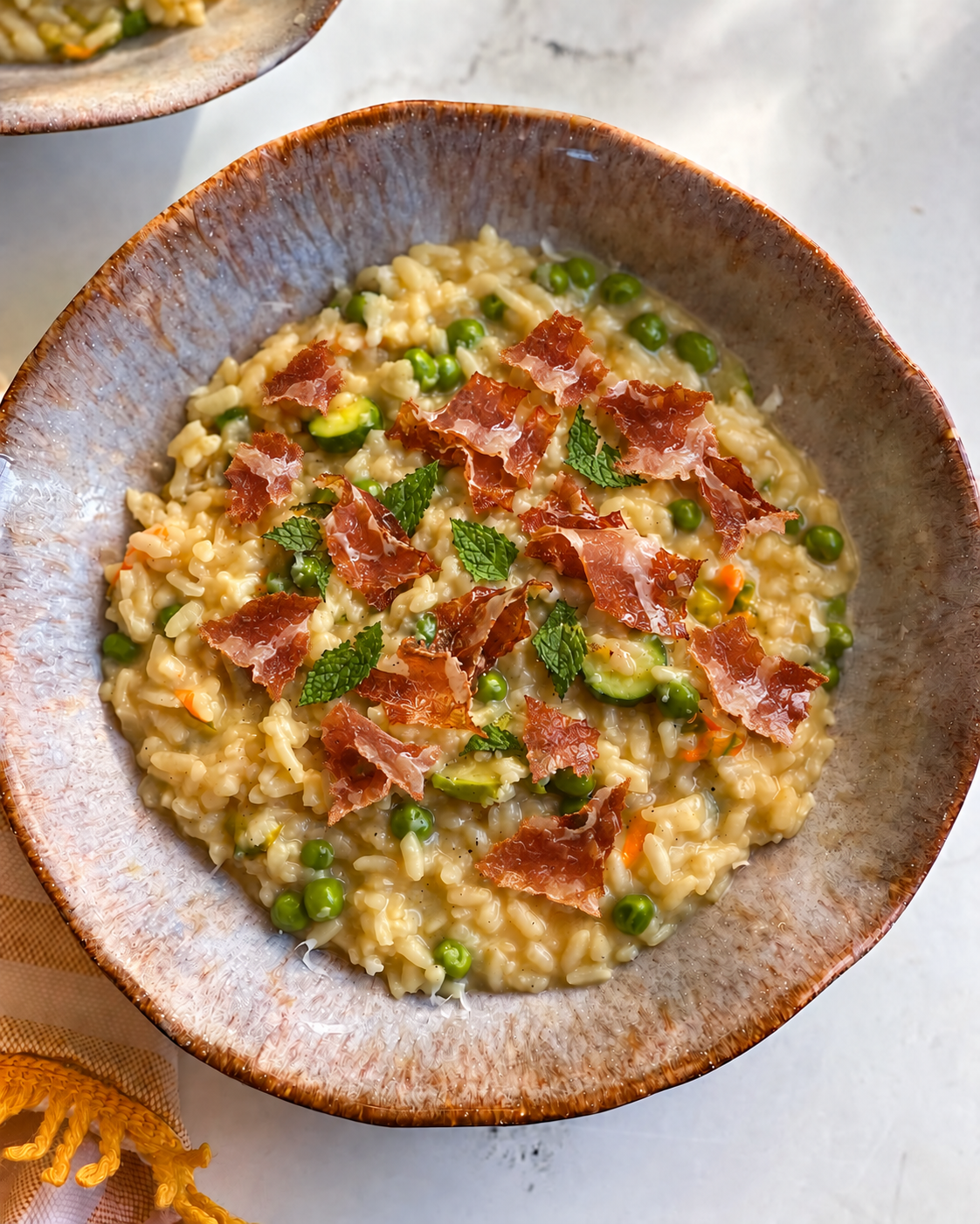 Risotto Primavera con prosciutto crudo croccante e menta fresca